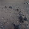 A row of pillars. Note how sandy the ground is.