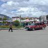 A taxi on the edge of the plaza in front of the Jokhang; the temple is visible in the background.