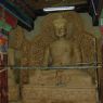 Clay statues of the Buddha under construction on the first floor of the temple.