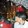 A monk attending to the butter lamps offered to Jowo Rinpoche, a statue of the Buddha believed to date from the seventh century and the most sacred image in Tibet.