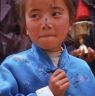 young child with blessing on nose