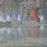 Painted carvings of bodhisattvas and Shakyamuni Buddha in a rock face.