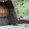 A house built near the area where houses were destroyed by fire in the village of Lo, in Kong po