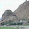 A hillside temple (red) and a farmhouse (white) near the monastery.