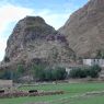 A hillside temple (red) and a farmhouse (white) near the monastery.