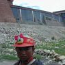 A young Tibetan girl standing in front of the South Complex.