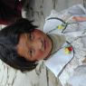 A young Tibetan girl in one of the monastery's courtyards.