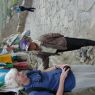 A young Tibetan tour guide with a tourist.