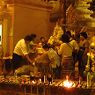 A family lustrates a shrine at Schwedagon Pagoda.