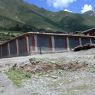 Wall with painted stripes characteristic of Sakya sect religious affiliation near the Derge monastery.