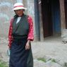 Tibetan woman next to the monastery.