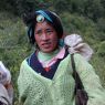 Tibetan woman with turquoise hair ornament.