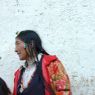 Tibetan woman with turquoise hair ornament.