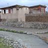 Tibetan houses made of earthen walls and logs.