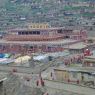 A stream of nuns walking to their own Assemly Hall ['du khang].