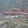 A stream of nuns walking to their own Assemly Hall ['du khang].