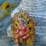 Details of the mandala representation on the outside perimeter of the Gyutrul Temple--closeup of a statue of a wrathful deity.