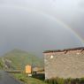 A rainbow over a house near the orphanage.