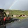 A rainbow over a house near the orphanage.