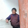 An elderly Tibetan woman visiting the monastery.