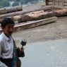 A lay pilgrim spinning a prayer wheel.