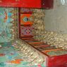 Statues of Padmasambhava along the wall on the second floor of the Zangdok Pelri Temple.