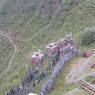 A view of prayer flags and wooden stupas on the hillside down from the Zangdok Pelri Temple.