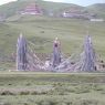 Prayer flags hung from a group of towers near a monastery of the Nyingma religious sect.