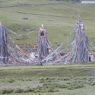 Prayer flags hung from a group of towers near a monastery of the Nyingma religious sect.