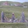 Prayer flags hung from a group of towers near a monastery of the Nyingma religious sect.