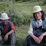 Two nomad men taking a break along the side of the road.