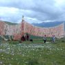 People gathered at the prayer flag frame on top of one of the hills around Larung Gar.