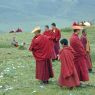 Monks talking at the top of the hill near the cairn.