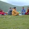 Chinese monks eating lunch on top of the hill.