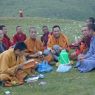 Chinese monks eating lunch on top of the hill.