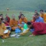 Chinese monks eating lunch on top of the hill.