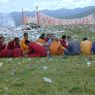 Chinese monks eating lunch on top of the hill.