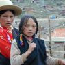 Nomad girls walking along the street.