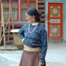 A restaurant worker standing outside the restaurant.