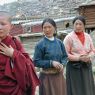 A Chinese nun and two Tibetan women waiting for Khenpo Jikme Phutsok, the founder of the Larung Gar religious community, to arrive.