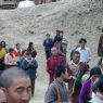 People following behind the car of Khenpo Jikme Phutsok, the founder of the Larung Gar religious community.