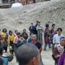 People following behind the car of Khenpo Jikme Phutsok, the founder of the Larung Gar religious community.