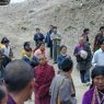 People following behind the car of Khenpo Jikme Phutsok, the founder of the Larung Gar religious community.