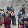 People following behind the car of Khenpo Jikme Phutsok, the founder of the Larung Gar religious community.