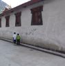 Two boys near temple in Dartsedo (Kangding)