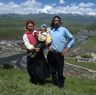 Tibetan&nbsp;family standing on a mountain over Lhagang town.&nbsp;