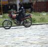 Tibetan man riding motorcycle in Lhagang town.&nbsp;