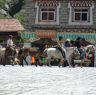 Nomads riding horses in Lhagang town.&nbsp;