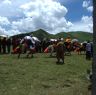 Tibetan men racing horses in Lhagang.&nbsp;