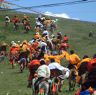 Tibetan men racing horses at Lhagang horse festival.